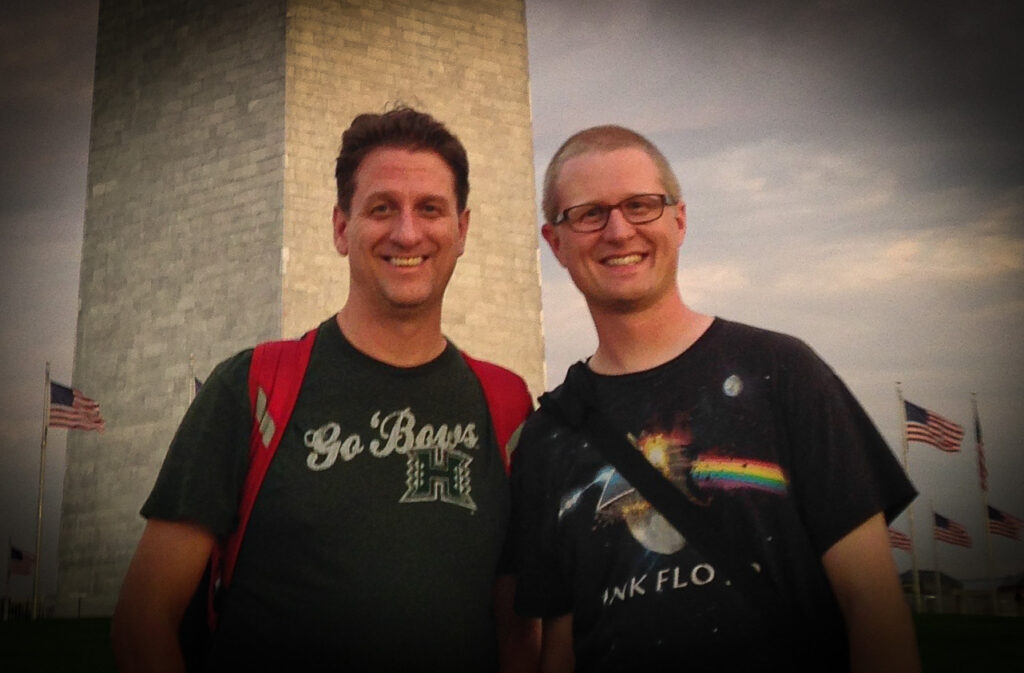 Brett and Joe Oppegaard standing in front of the Washington Monument in Washington, D.C.